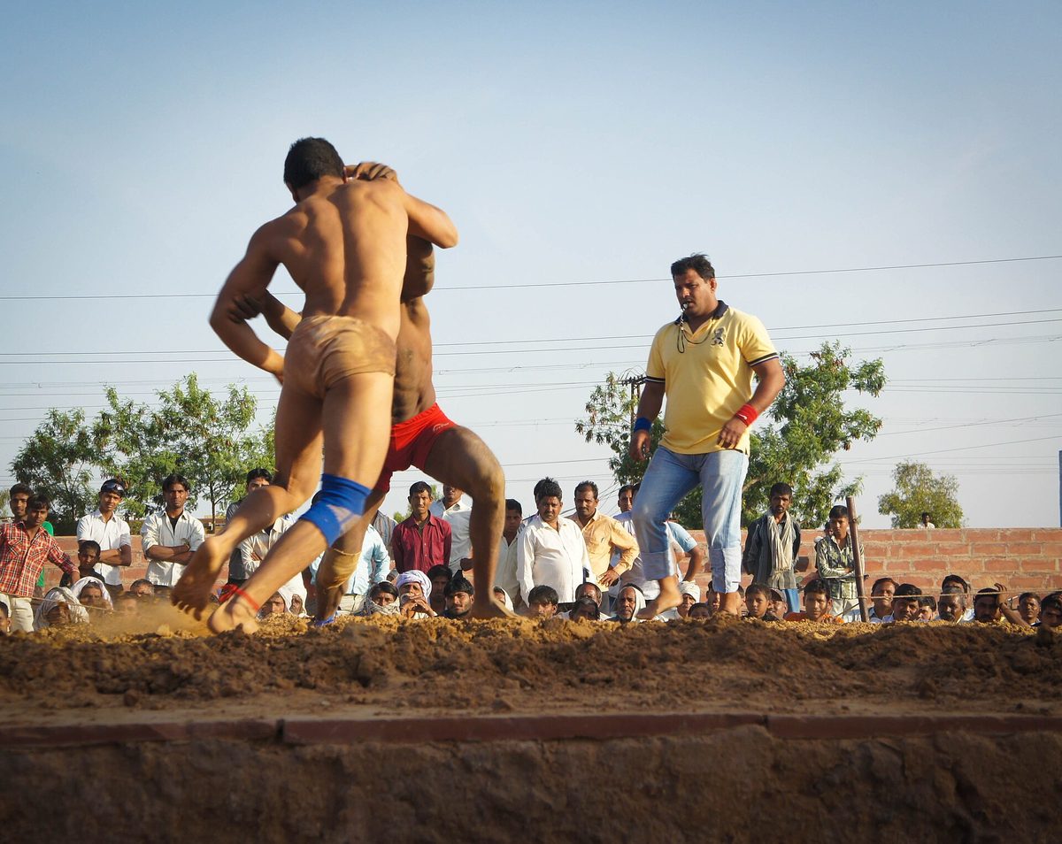 A kushti bout in progress before a village crowd